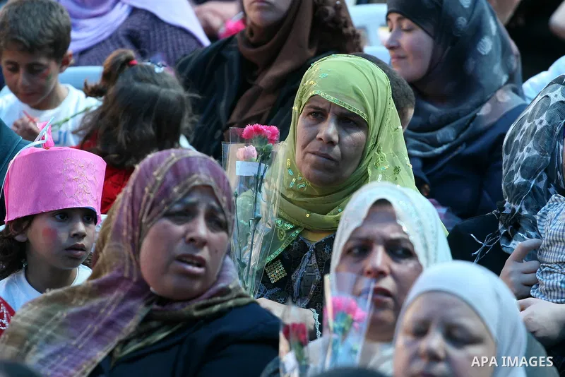 Palestinian women attend a celebration at Al-Walajah school on the occasion of Mother Day in Walajah village near the West Bank city of Bethlehem on March 21, 2011. Photo by Issam Rimawi