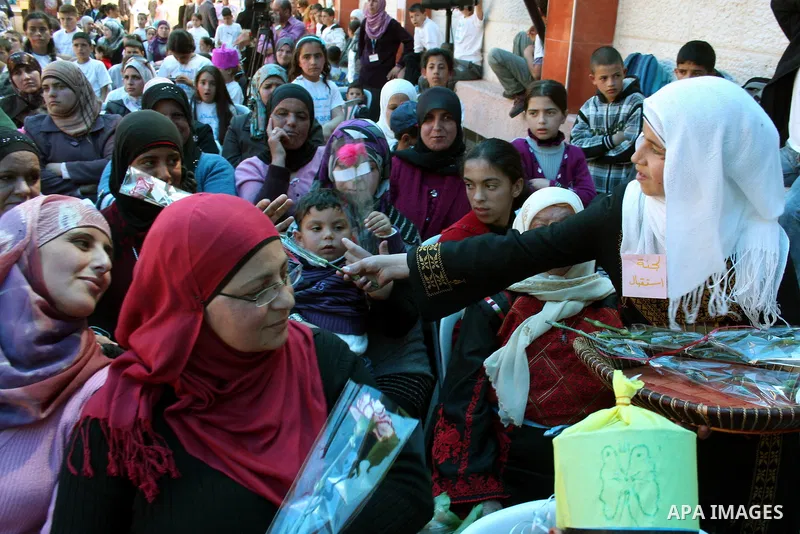 Palestinian women attend a celebration at Al-Walajah school on the occasion of Mother Day in Walajah village near the West Bank city of Bethlehem on March 21, 2011. Photo by Issam Rimawi