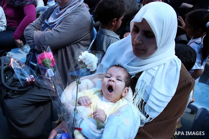 Palestinian women attend a celebration at Al-Walajah school on the occasion of Mother Day in Walajah village near the West Bank city of Bethlehem on March 21, 2011. Photo by Issam Rimawi
