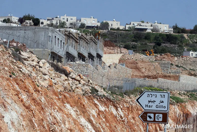 Israeli bulldozers work in the settlement of Har Gillo near Jerusalem on March 21, 2011. Photo by Issam Rimawi
