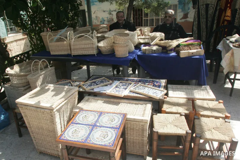 Palestinian women show their home made tradition works during an exhibition in the ocassion of the Mother Day at Jerusalem youth club, in Jerusalem on March 21, 2011. Photo by Mahfouz Abu Turk
