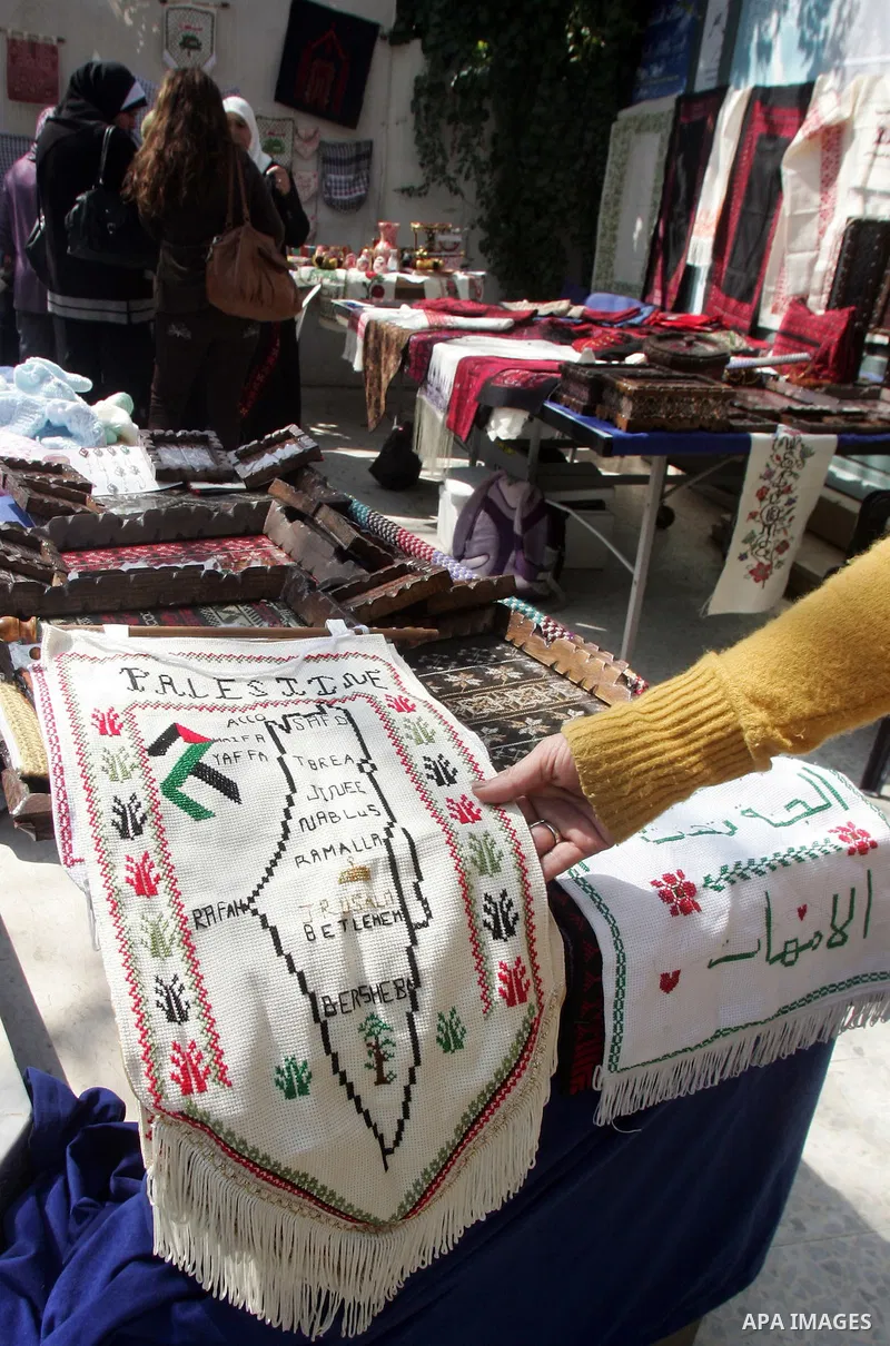 Palestinian women show their home made tradition works during an exhibition in the ocassion of the Mother Day at Jerusalem youth club, in Jerusalem on March 21, 2011. Photo by Mahfouz Abu Turk