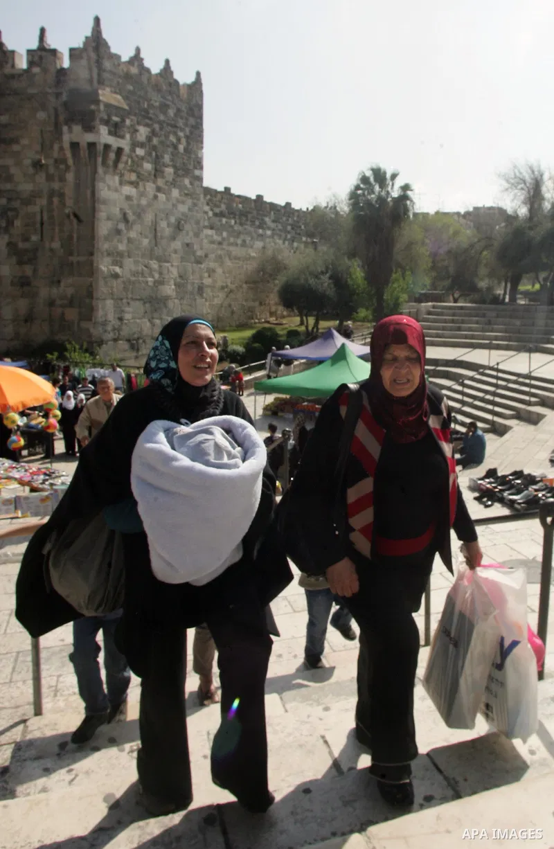 Palestinian women show their home made tradition works during an exhibition in the ocassion of the Mother Day at Jerusalem youth club, in Jerusalem on March 21, 2011. Photo by Mahfouz Abu Turk