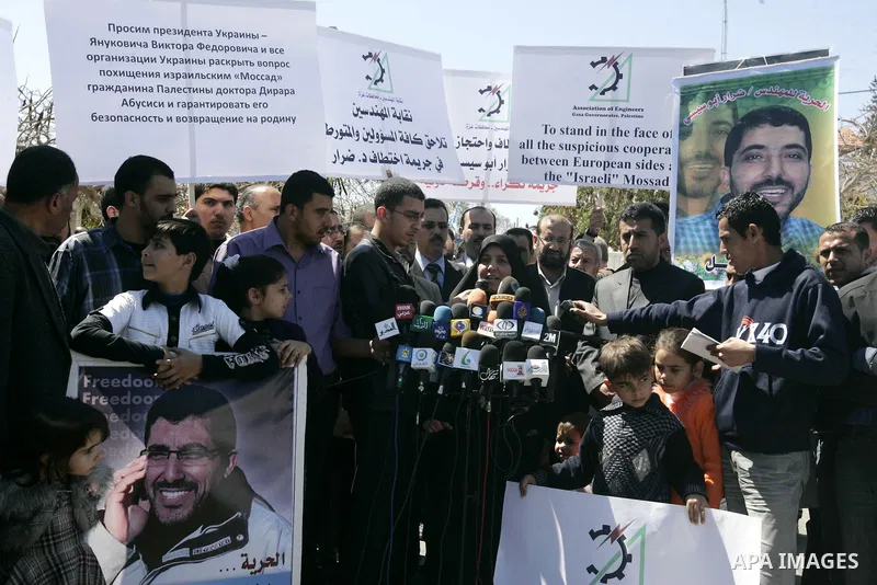 Co-workers and family members of palestinian kidnapped engineer Derar Abu Sissi hold his photos during protest calling for his release in Gaza March 22,2011. Derar Abu sissi was kidnapped by the mossad men in Ukrania on...