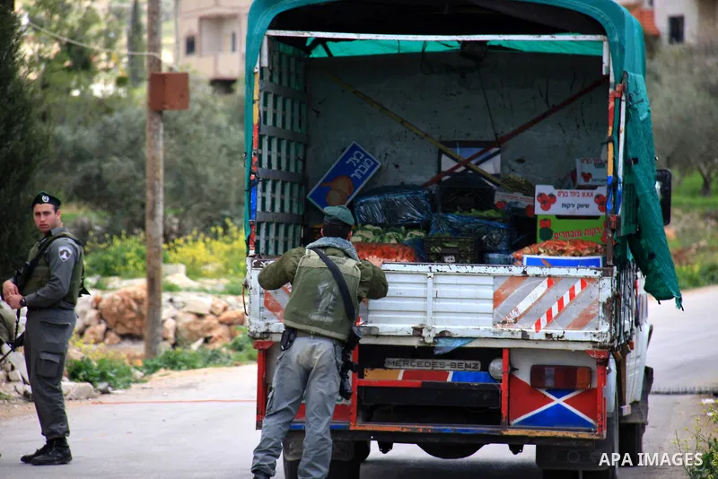 Israeli troops operate during a military operation searching for suspects in the West Bank village of Awarta near Nablus,the army Imposed a curfew in the village following an attack in a nearby Jewish settlement that kil...