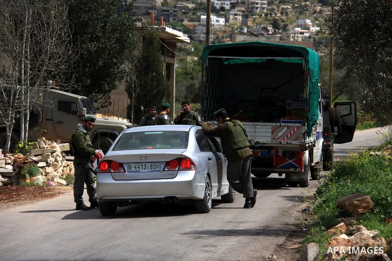Israeli troops operate during a military operation searching for suspects in the West Bank village of Awarta near Nablus,the army Imposed a curfew in the village following an attack in a nearby Jewish settlement that kil...