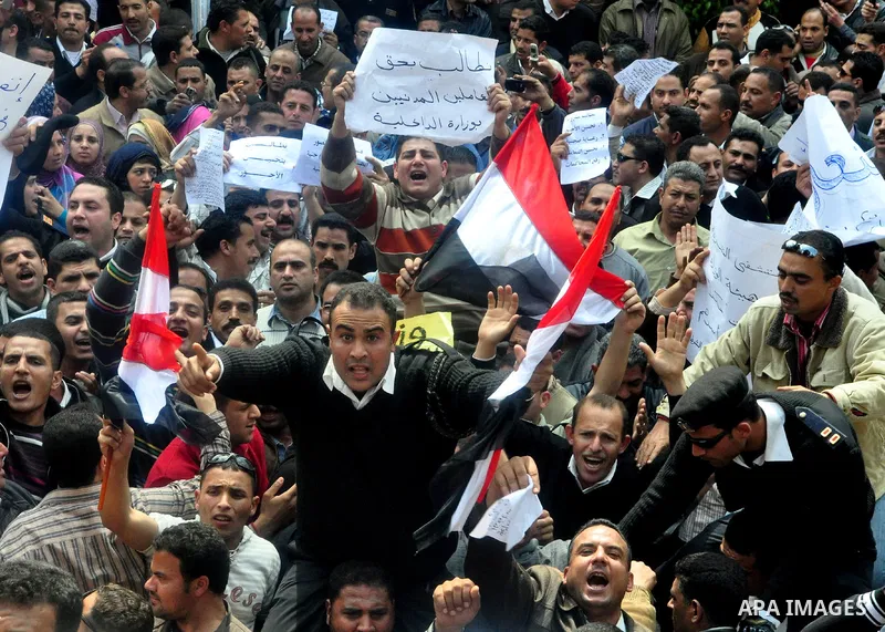 Egyptian police protest in front of the Interior Ministry calling for a raise in their wages in Cairo, Egypt, Tuesday, March 22, 2011. The Arabic on building reads:" Interior Ministry.". Photo by Ahmed Asad