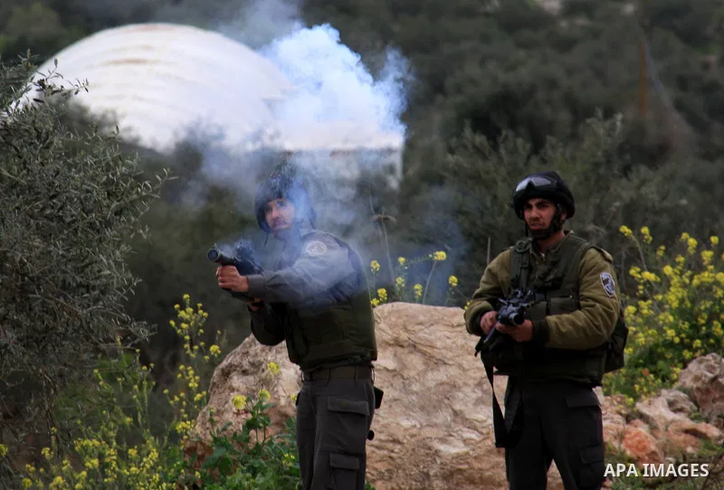 Israeli border policemen fire tear gas canisters towards Palestinian stone-throwers during clashes outside the West Bank Palestinian village of Awarta, near Nablus March 22, 2011. Israeli troops have been operating in th...
