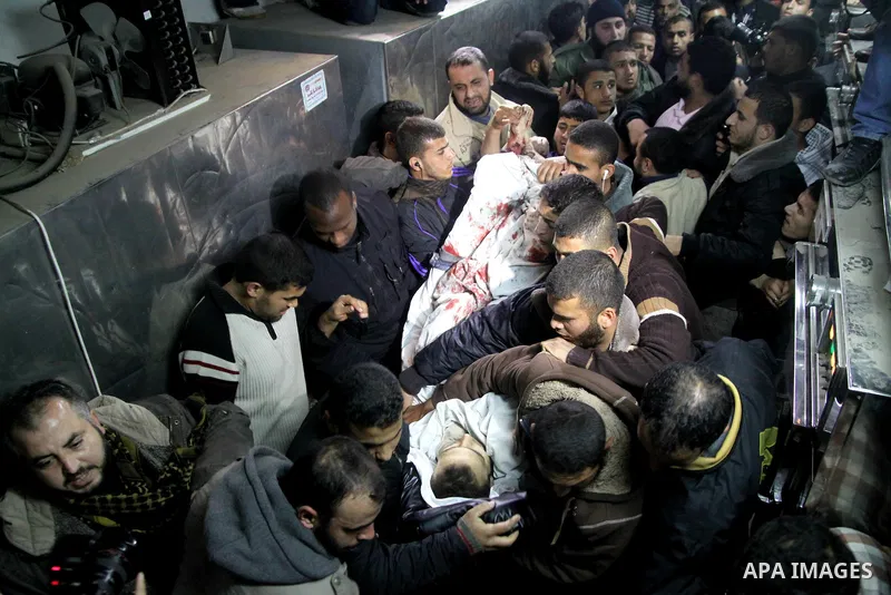 A Palestinian militant killed in an Israeli air strike is deplaced at al-Shifa hospital in Gaza City on March 22, 2011. Three members of the Al Quds Brigades, the armed wing of the radical Islamic Jihad, were killed and...