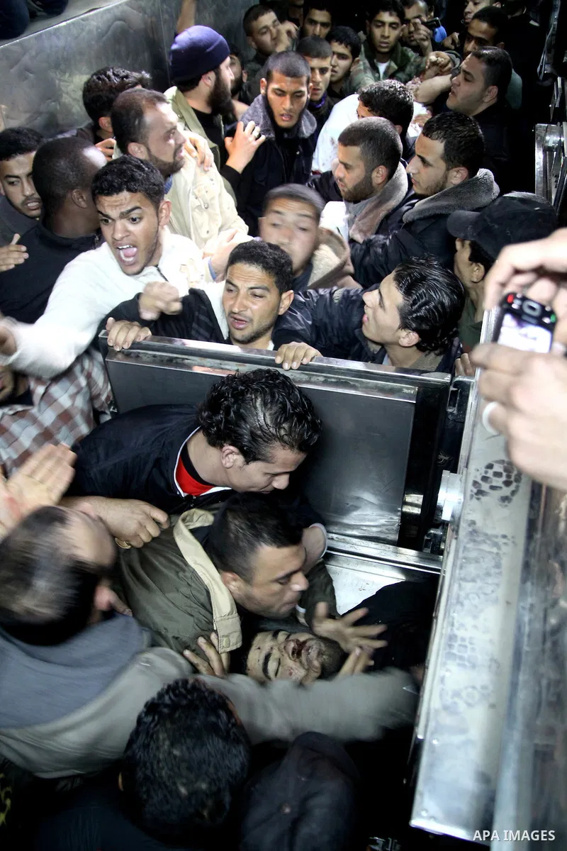 A Palestinian militant killed in an Israeli air strike is deplaced at al-Shifa hospital in Gaza City on March 22, 2011. Three members of the Al Quds Brigades, the armed wing of the radical Islamic Jihad, were killed and...
