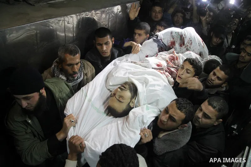 A Palestinian militant killed in an Israeli air strike is deplaced at al-Shifa hospital in Gaza City on March 22, 2011. Three members of the Al Quds Brigades, the armed wing of the radical Islamic Jihad, were killed and...