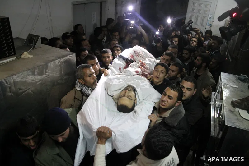 A Palestinian militant killed in an Israeli air strike is deplaced at al-Shifa hospital in Gaza City on March 22, 2011. Three members of the Al Quds Brigades, the armed wing of the radical Islamic Jihad, were killed and...