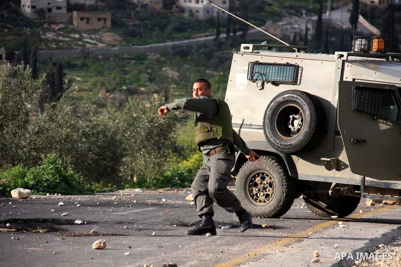 Israeli border policemen fire tear gas canisters towards Palestinian stone-throwers during clashes outside the West Bank Palestinian village of Awarta, near Nablus March 22, 2011. Israeli troops have been operating in th...