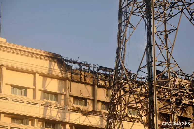 Egyptian firefighters operate on one of the building of the Interior Ministry after a fire erupted, in Cairo, Egypt, 22 March 2011. Egypt's Interior Ministry building was set ablaze by disgruntled police officers on 22 M...
