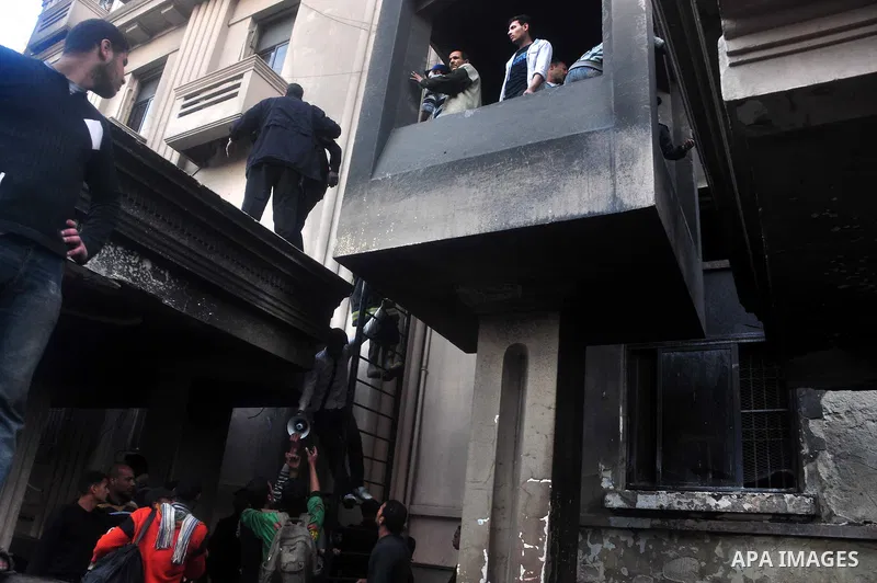 Egyptian firefighters operate on one of the building of the Interior Ministry after a fire erupted, in Cairo, Egypt, 22 March 2011. Egypt's Interior Ministry building was set ablaze by disgruntled police officers on 22 M...