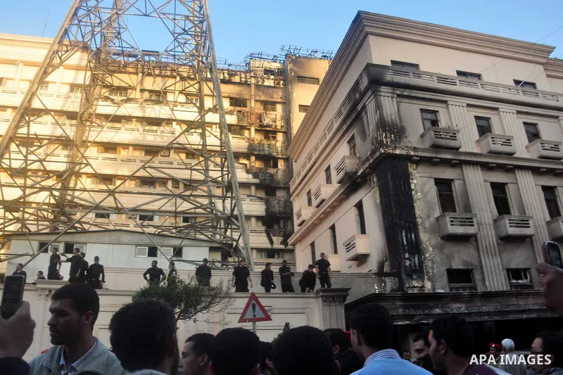 Egyptian firefighters operate on one of the building of the Interior Ministry after a fire erupted, in Cairo, Egypt, 22 March 2011. Egypt's Interior Ministry building was set ablaze by disgruntled police officers on 22 M...