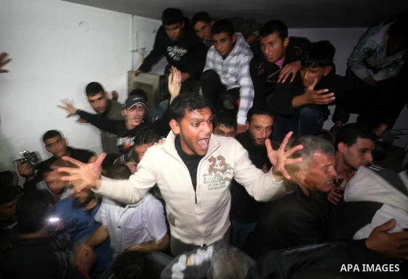A Palestinian militant killed in an Israeli air strike is deplaced at al-Shifa hospital in Gaza City on March 22, 2011. Three members of the Al Quds Brigades, the armed wing of the radical Islamic Jihad, were killed and...