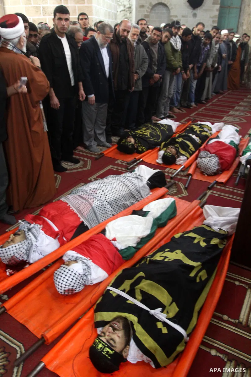 Palestinian mourners attend a funeral at a mosque in Gaza City on March 23, 2011 a day after eight Gazans were killed, among them two minors and four militants, as tensions soared on the border with Israel after days of...