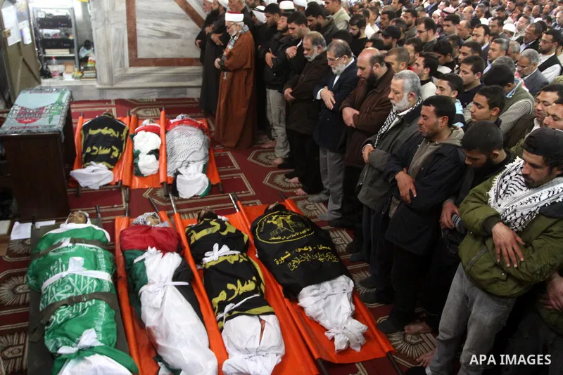 Palestinian mourners attend a funeral at a mosque in Gaza City on March 23, 2011 a day after eight Gazans were killed, among them two minors and four militants, as tensions soared on the border with Israel after days of...