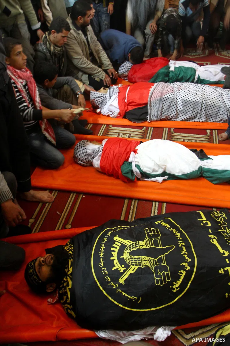 Palestinian mourners attend a funeral at a mosque in Gaza City on March 23, 2011 a day after eight Gazans were killed, among them two minors and four militants, as tensions soared on the border with Israel after days of...