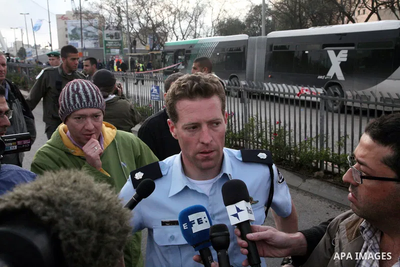 An Israeli official speaks to media at the scene of a bomb attack at a bus station in Jerusalem blowing up next to the bus and near a kiosk, called the 'Explosive Kiosk', on 23 March 2011. Over 30 people were injured by...