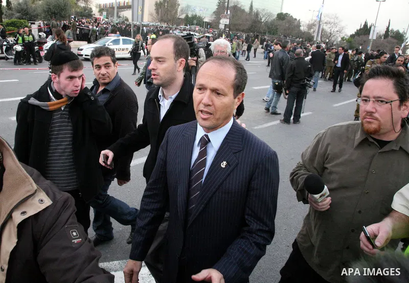 An Israeli official speaks to media at the scene of a bomb attack at a bus station in Jerusalem blowing up next to the bus and near a kiosk, called the 'Explosive Kiosk', on 23 March 2011. Over 30 people were injured by...
