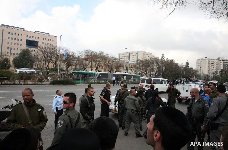 Israeli police patrol at the scene of a bomb attack at a bus station in Jerusalem blowing up next to the bus and near a kiosk, called the 'Explosive Kiosk', on 23 March 2011. Over 30 people were injured by a parcel bomb...