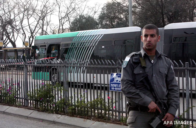 Israeli police patrol at the scene of a bomb attack at a bus station in Jerusalem blowing up next to the bus and near a kiosk, called the 'Explosive Kiosk', on 23 March 2011. Over 30 people were injured by a parcel bomb...