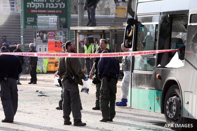Israeli police patrol at the scene of a bomb attack at a bus station in Jerusalem blowing up next to the bus and near a kiosk, called the 'Explosive Kiosk', on 23 March 2011. Over 30 people were injured by a parcel bomb...