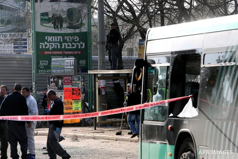 Israeli police patrol at the scene of a bomb attack at a bus station in Jerusalem blowing up next to the bus and near a kiosk, called the 'Explosive Kiosk', on 23 March 2011. Over 30 people were injured by a parcel bomb...