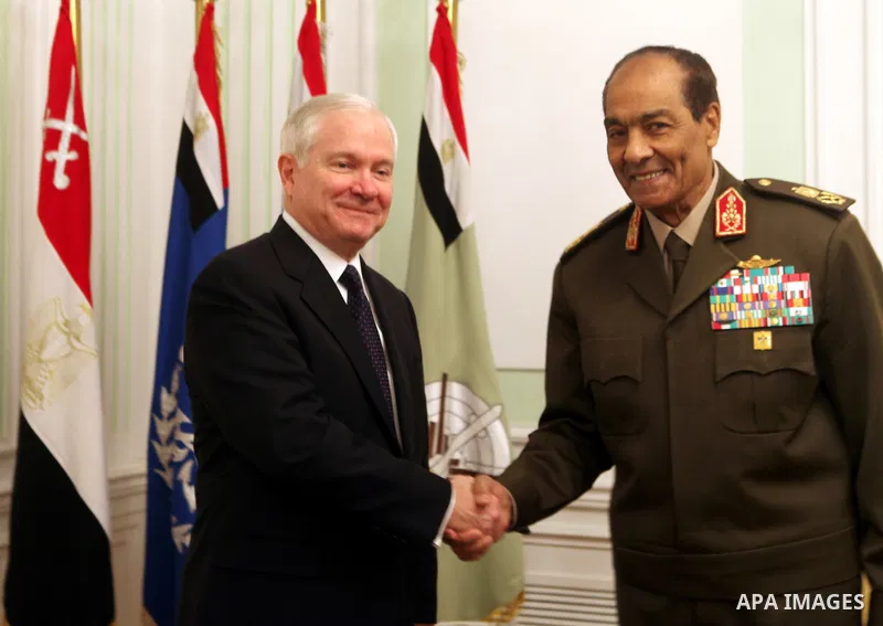 The Chairman of the Egyptian Supreme Council of Armed Forces, Mohammed Hussein Tantawi (R) and US Defense Secretary Robert Gates pose for a photograph at the start of their meeting at the Defense Ministry, in Cairo, on M...