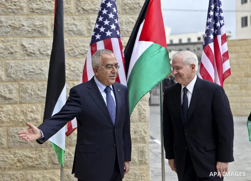 U.S Defense Secretary Robert Gates meets with Palestinian Prime Minister Salam Fayyad in the West Bank city of Ramallah March 25, 2011. Gates urged Israeli and Palestinian leaders on Thursday to advance stalled peace eff...