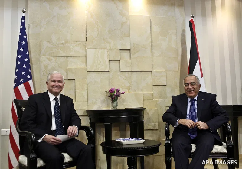 U.S Defense Secretary Robert Gates meets with Palestinian Prime Minister Salam Fayyad in the West Bank city of Ramallah March 25, 2011. Gates urged Israeli and Palestinian leaders on Thursday to advance stalled peace eff...