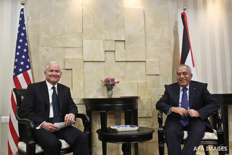 U.S Defense Secretary Robert Gates meets with Palestinian Prime Minister Salam Fayyad in the West Bank city of Ramallah March 25, 2011. Gates urged Israeli and Palestinian leaders on Thursday to advance stalled peace eff...