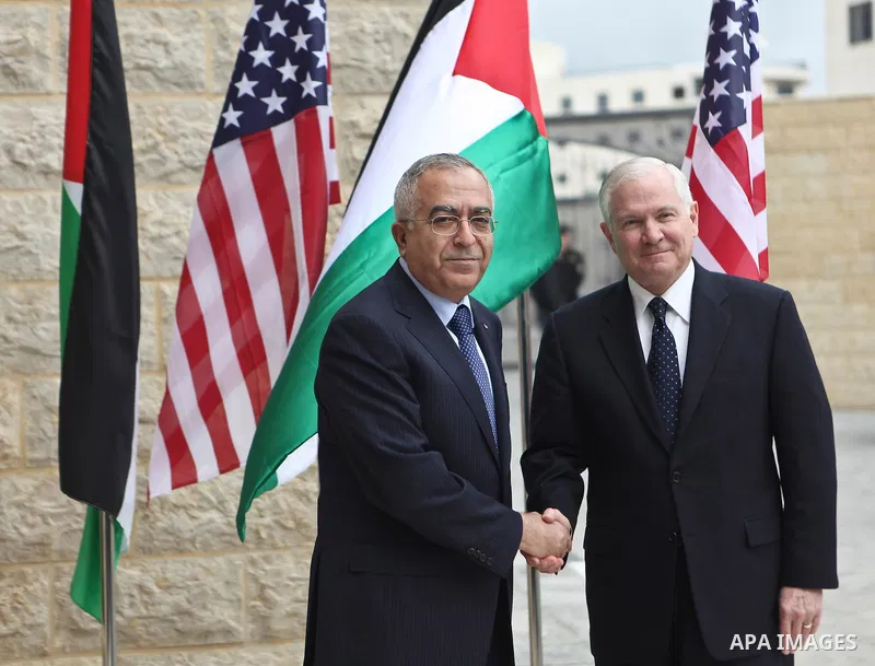 U.S Defense Secretary Robert Gates meets with Palestinian Prime Minister Salam Fayyad in the West Bank city of Ramallah March 25, 2011. Gates urged Israeli and Palestinian leaders on Thursday to advance stalled peace eff...