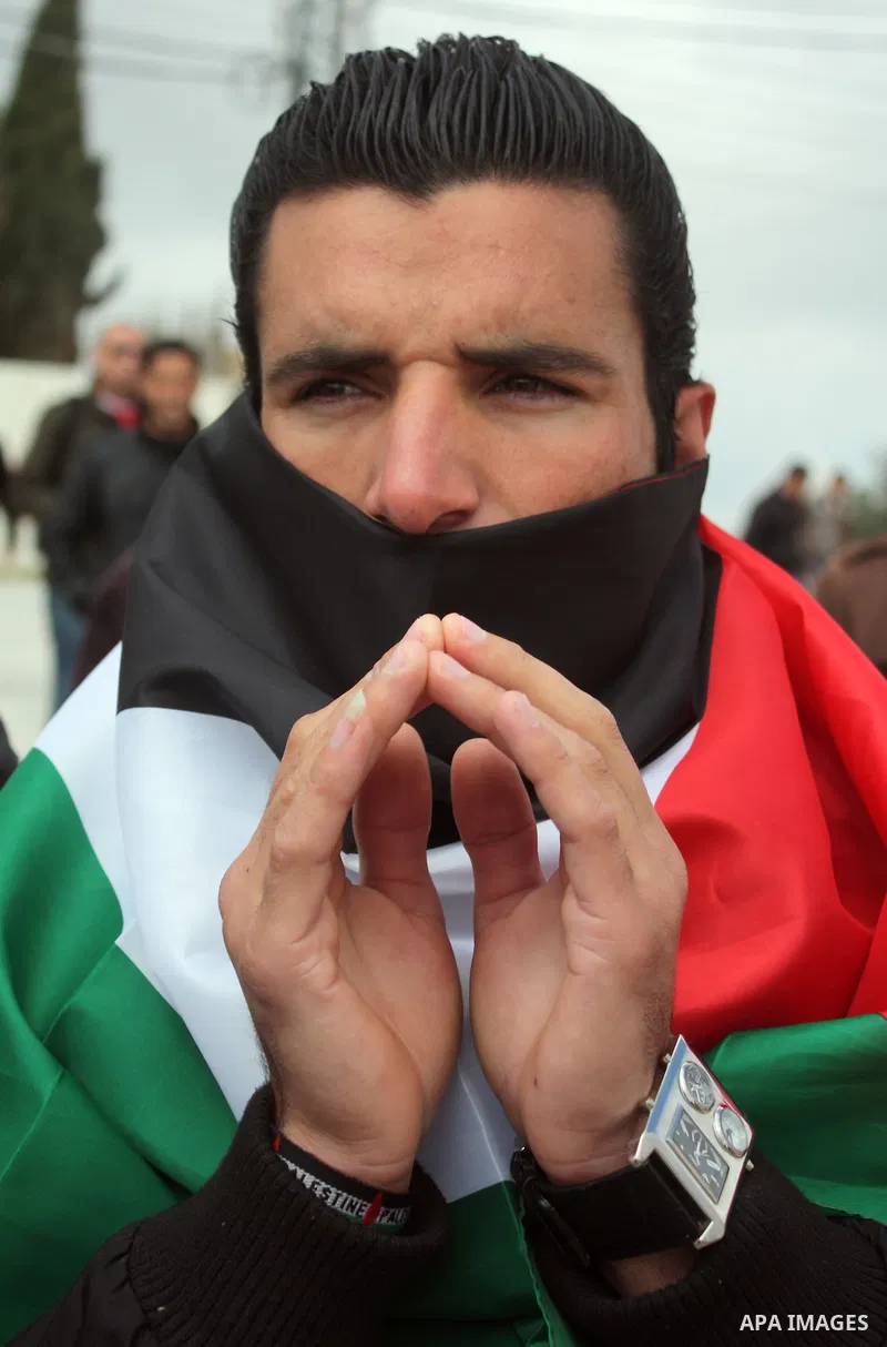 Protesters argue with an Israeli soldier during a demonstration against Israel's controversial separation barrier in the West Bank village of Maasarah, near the biblical town of Bethlehem on March 25, 2011.Israel says th...