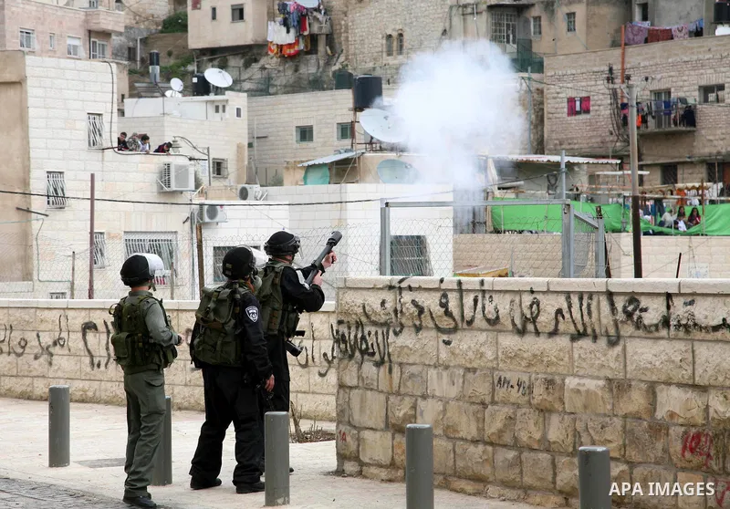Israeli Border Police fire tear gas towards Palestinian stone throwers during clashes in the mostly Arab neighborhood of Silwan in East Jerusalem March 25, 2011. Photo by Sliman Khader..