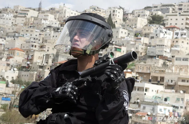 Israeli Border Police fire tear gas towards Palestinian stone throwers during clashes in the mostly Arab neighborhood of Silwan in East Jerusalem March 25, 2011. Photo by Mahfouz abu Turk .