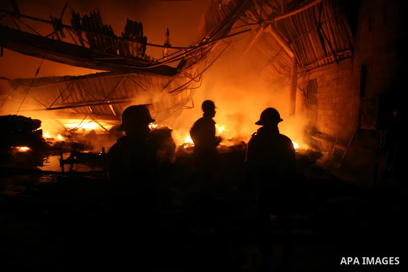 Palestinian firemen fighting the fire broke out in a soft drinks factory in Gaza after huge explosion hit the place in zeiton neighborhood Gaza city. March 25 2011. Despite Israel military said none of its forces were op...