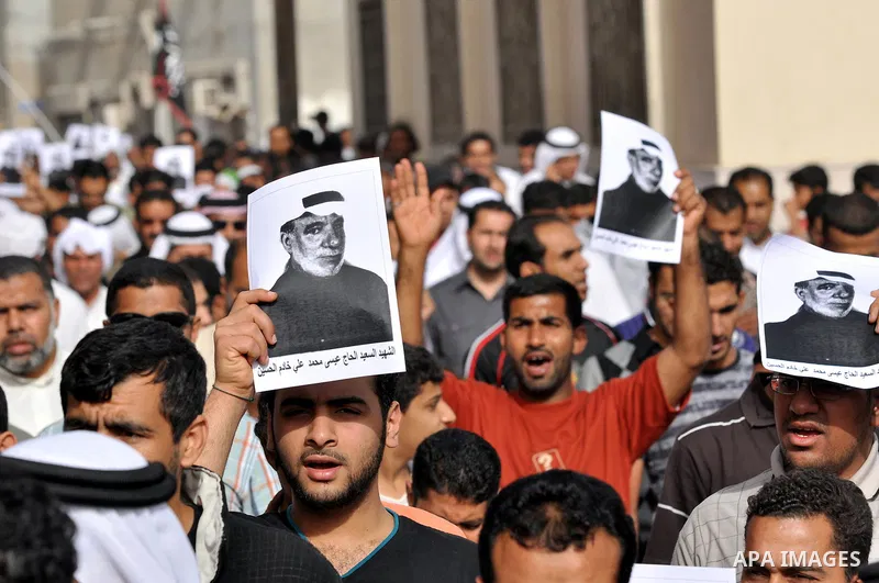 Pro-reforms protesters march during the funeral of 71-year-old Isa Mohammed in Maamer village south east of the capital Manama, Bahrain, 26 March 2011. According to local media reports, Mohammed died on 25 March after te...
