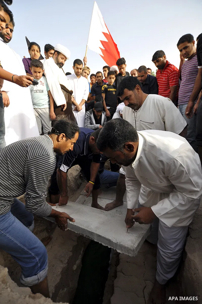Pro-reforms protesters march during the funeral of 71-year-old Isa Mohammed in Maamer village south east of the capital Manama, Bahrain, 26 March 2011. According to local media reports, Mohammed died on 25 March after te...
