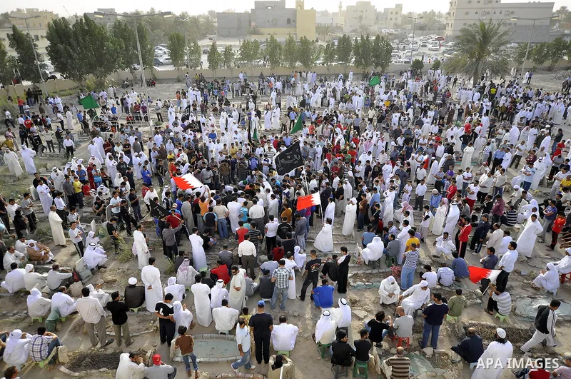Pro-reforms protesters march during the funeral of 71-year-old Isa Mohammed in Maamer village south east of the capital Manama, Bahrain, 26 March 2011. According to local media reports, Mohammed died on 25 March after te...