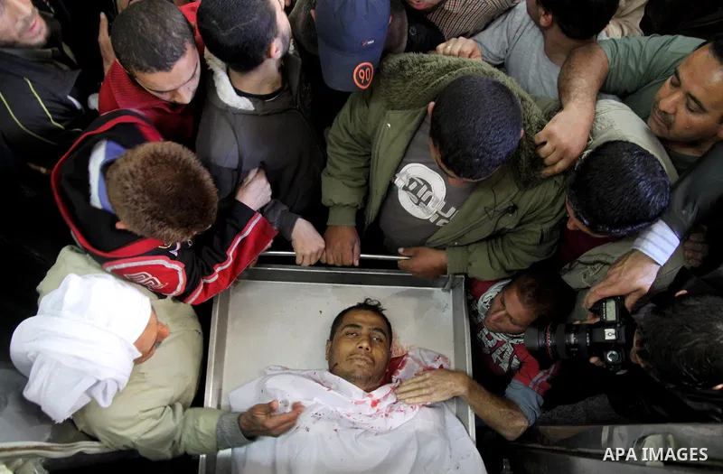 Relatives of Palestinian militants look at there bodies in the morgue of Kamal Edwan hospital in Beit Lahya northern Gaza strip. March 27, 2011. Photo by Ali Jadallh