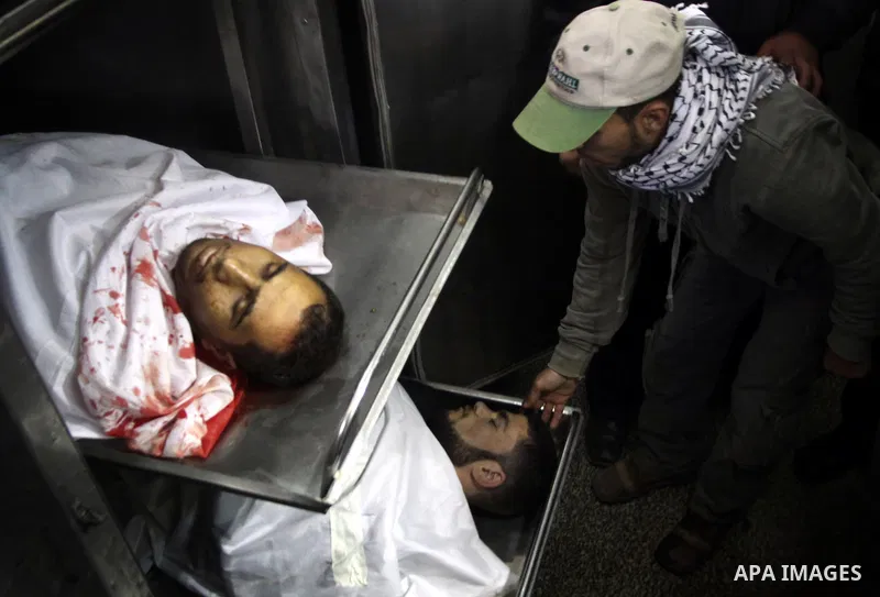 Relatives of Palestinian militants look at thier bodies in the morgue of Kamal Edwan hospital in Beit Lahya northern Gaza strip. March 27, 2011. Photo by Ali Jadallh