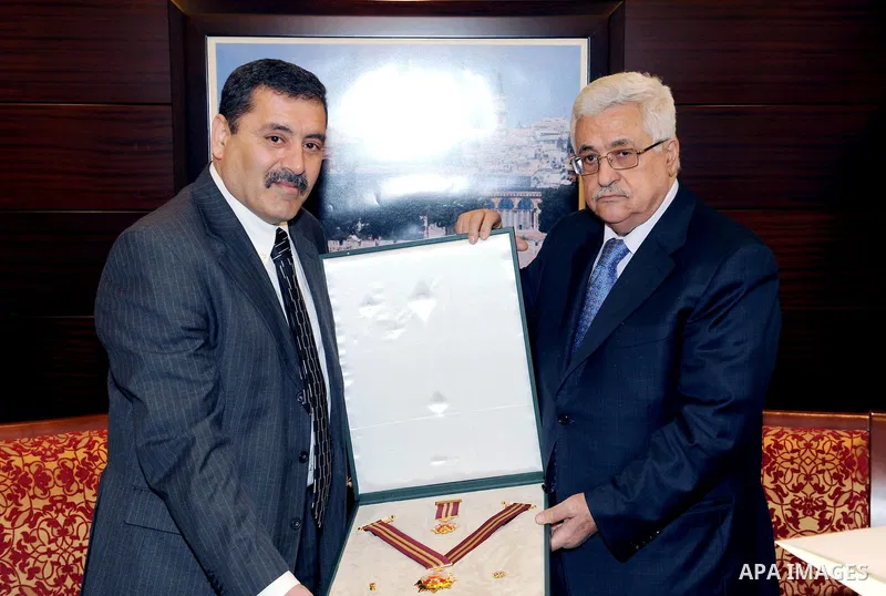Palestinian President Mahmoud Abbas (Abu Mazen) gives the Ambassador of Tunisia the Star of Jerusalem, west bank the city of Ramallah March 27,2011 Photo by Thaer Ganaim.