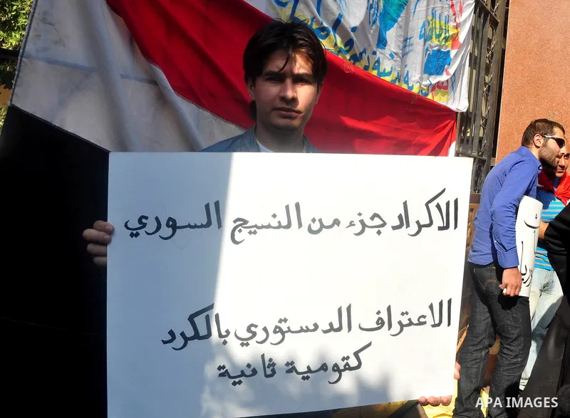 Syrians living in Egypt demonstrate against the recent actions of the Syrian government and in support of protesters, outside the Arab League headquarters in Cairo, Egypt Sunday, March 27, 2011. Syrian army units deploye...