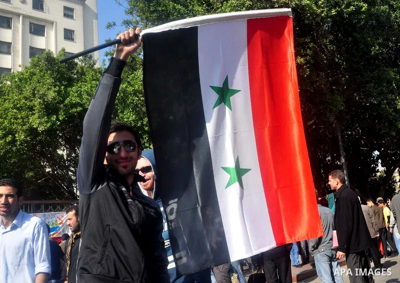 Syrians living in Egypt demonstrate against the recent actions of the Syrian government and in support of protesters, outside the Arab League headquarters in Cairo, Egypt Sunday, March 27, 2011. Syrian army units deploye...