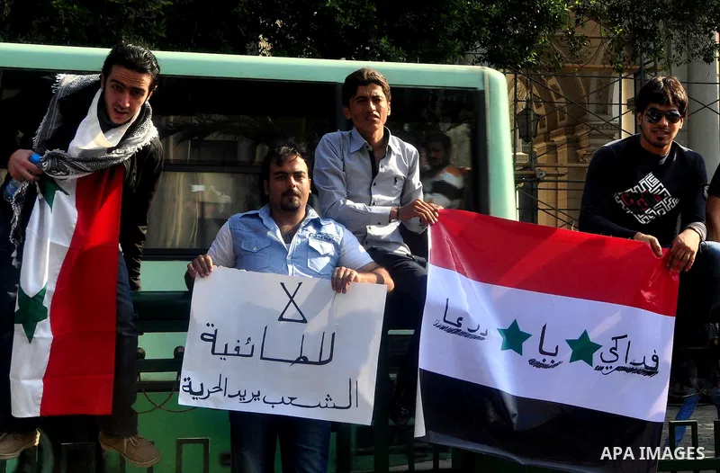 Syrians living in Egypt demonstrate against the recent actions of the Syrian government and in support of protesters, outside the Arab League headquarters in Cairo, Egypt Sunday, March 27, 2011. Syrian army units deploye...