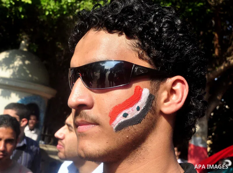 Syrians living in Egypt demonstrate against the recent actions of the Syrian government and in support of protesters, outside the Arab League headquarters in Cairo, Egypt Sunday, March 27, 2011. Syrian army units deploye...