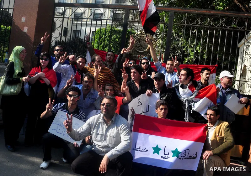 Syrians living in Egypt demonstrate against the recent actions of the Syrian government and in support of protesters, outside the Arab League headquarters in Cairo, Egypt Sunday, March 27, 2011. Syrian army units deploye...
